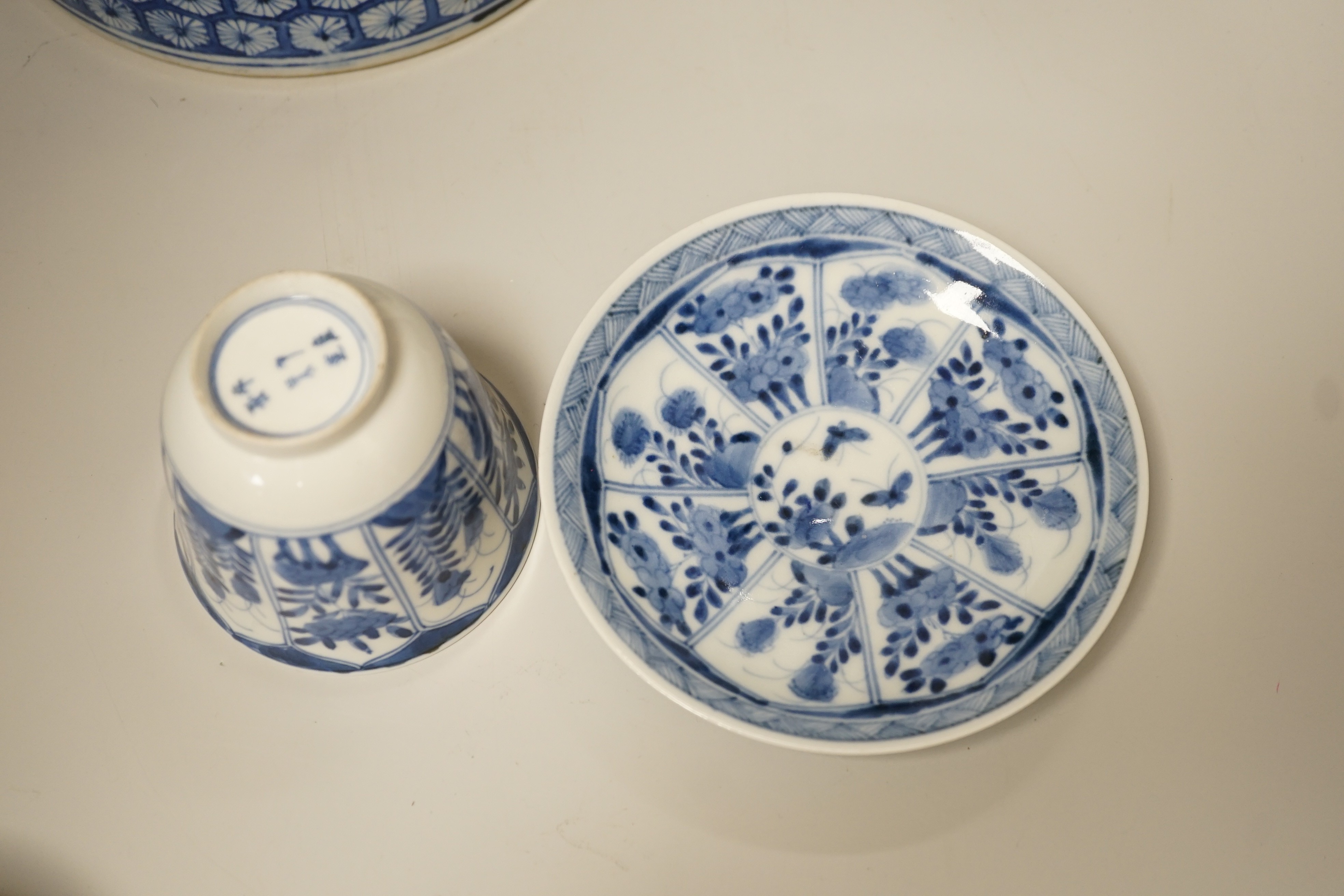 A Chinese blue and white brushpot, enamelled jar, brush pot, famille verte jar cover and a Japanese blue and white tea bowl and cover. Tallest 18cm